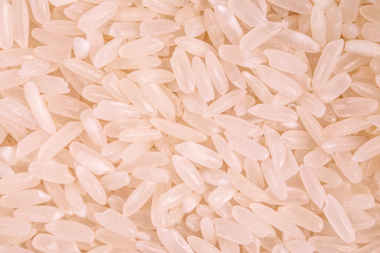 Crafting Captivating Headlines: Your awesome post title goes here A detailed macro shot of uncooked organic white rice showcasing its natural texture.
